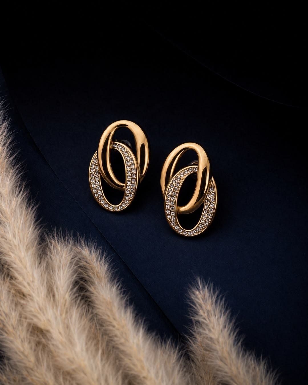 Model wearing gold drop earrings